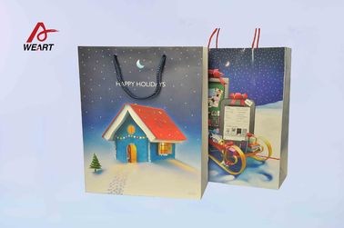 中国 芸術のクリスマスの紙袋は、独特なクリスマスのギフト青い綿のハンドルを袋に入れます 代理店